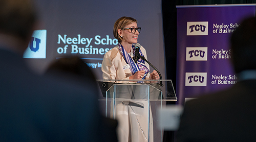 Section Image: Nikki Morris addresses the audience at the Energy Symposium 